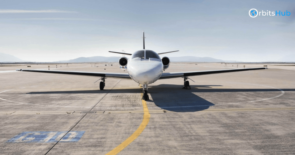 Front view of the Cessna C550 Citation II jet parked on a runway, highlighting its aerodynamic shape and readiness for flight